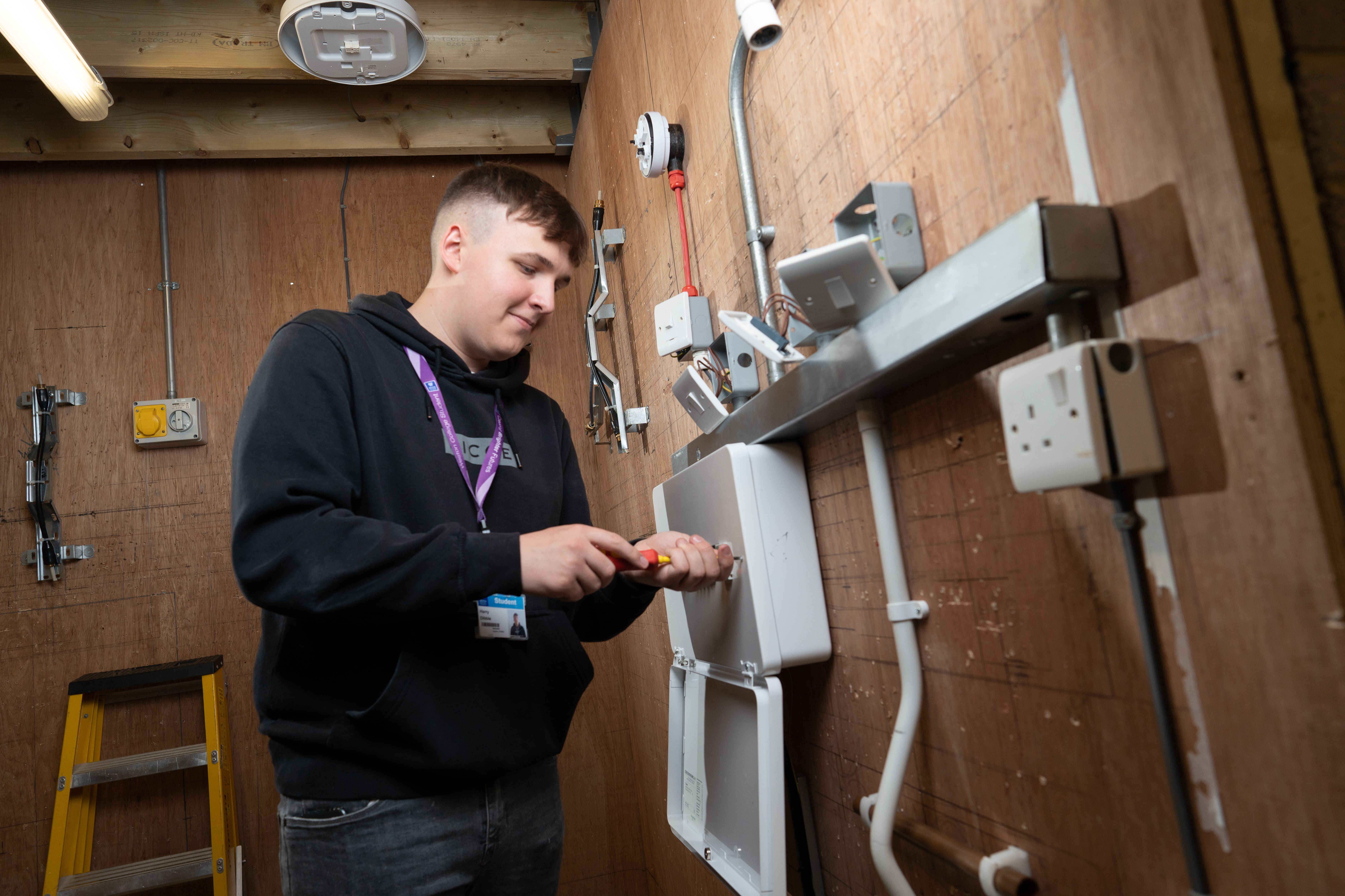 student electrician fitting switch    