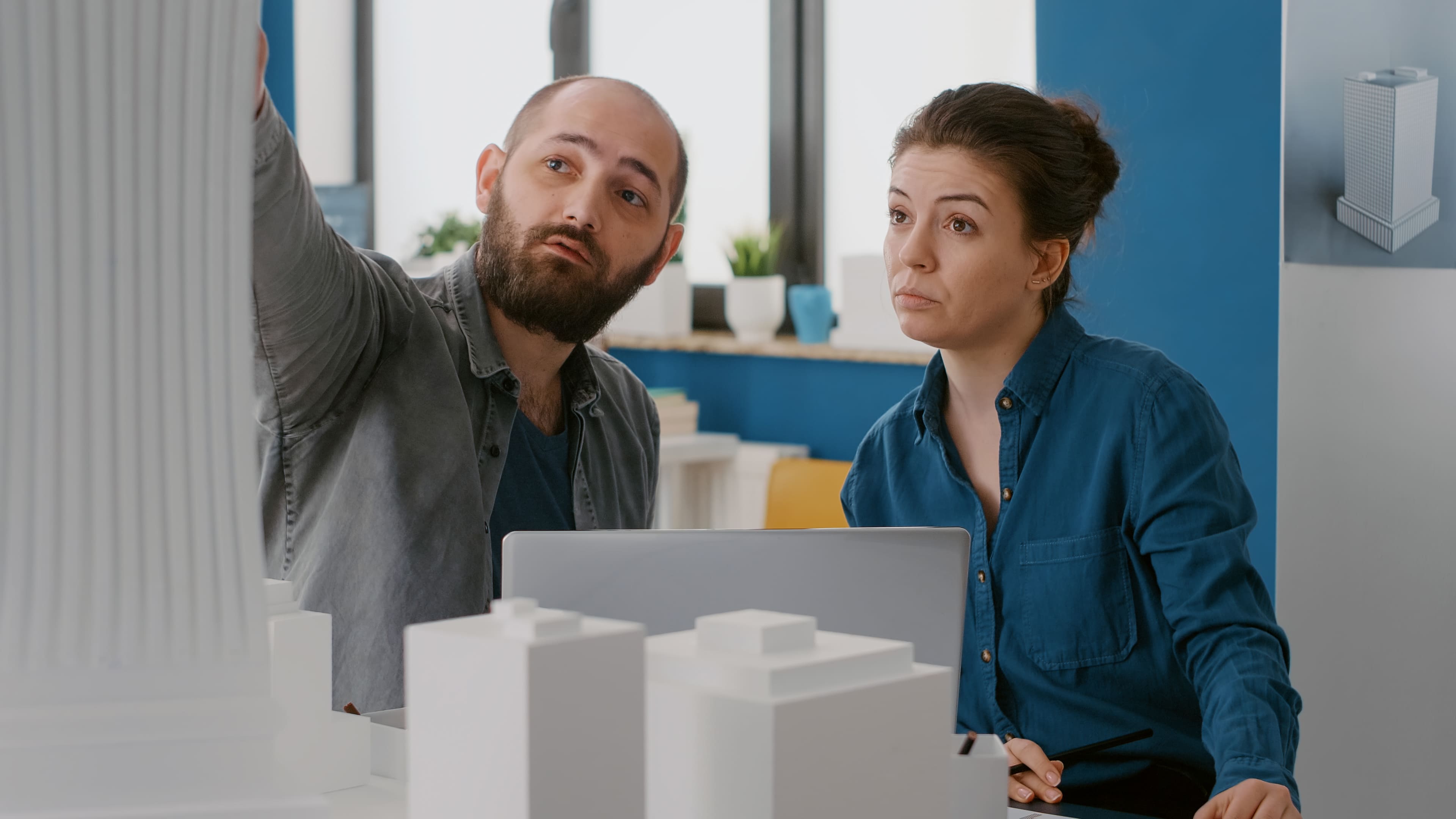 workmates looking at building design